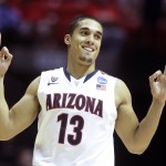 Arizona guard Nick Johnson gestures after making a three-point basket against Gonzaga during the second half of a third-round game in the NCAA college basketball tournament Sunday, March 23, 2014, in San Diego. (AP Photo/Lenny Ignelzi)