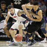 Arizona guard Gabe York, center left, and Xavier guard Larry Austin Jr. battle for a loose ball during the second half of a college basketball regional semifinal in the NCAA Tournament, Thursday, March 26, 2015, in Los Angeles. (AP Photo/Jae C. Hong)