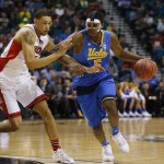 UCLA's Kevon Looney drives around Arizona's Brandon Ashley during the first half of an NCAA college basketball game in the semifinals of the Pac-12 conference tournament Friday, March 13, 2015, in Las Vegas. (AP Photo/John Locher)
