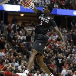 San Diego State forward Dwayne Polee II (5) dunks against Arizona during the first half of a regional semifinal in the NCAA men's college basketball tournament, Thursday, March 27, 2014, in Anaheim, Calif. (AP Photo/Jae C. Hong)