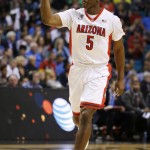 Arizona's Stanley Johnson celebrates after sinking a 3-point shot during the first half of an NCAA college basketball game against UCLA in the semifinals of the Pac-12 conference tournament Friday, March 13, 2015, in Las Vegas. (AP Photo/John Locher)