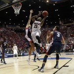 Arizona forward Rondae Hollis-Jefferson (23) shoots over Gonzaga forward Drew Barham during the first half of a third-round game in the NCAA college basketball tournament Sunday, March 23, 2014, in San Diego. (AP Photo/Lenny Ignelzi)