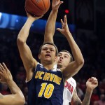 UC Irvine guard Luke Nelson (10) shoots in front of Arizona guard Gabe York (1) during the first half of an NCAA college basketball game, Wednesday, Nov. 19, 2014, in Tucson, Ariz. (AP Photo/Rick Scuteri)