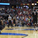 San Diego State guard Xavier Thames (2) kneels with 2.3 seconds remaing against Arizona during the second half in a regional semifinal NCAA college basketball tournament game, Thursday, March 27, 2014, in Anaheim, Calif. Arizona won 70-64. (AP Photo/Mark J. Terrill)