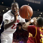 Arizona forward Rondae Hollis-Jefferson gets fouled by Southern California guard Chass Bryan (3) during the second half of an NCAA college basketball game, Thursday, Feb. 19, 2015, in Tucson, Ariz. (AP Photo/Rick Scuteri)