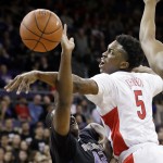 Arizona's Stanley Johnson (5) tries to knock the ball away as Washington's Donaven Dorsey drives during the first half of an NCAA college basketball game Friday, Feb. 13, 2015, in Seattle. (AP Photo/Elaine Thompson)