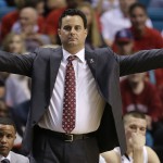 Arizona coach Sean Miller motions to players in the second half against Colorado during the second half of an NCAA college basketball game in the semifinals of the Pac-12 Conference on Friday, March 14, 2014, in Las Vegas. Arizona won 63-43. (AP Photo/Julie Jacobson)
