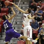 Arizona forward Aaron Gordon blocks the shot of Weber State's Joel Bolomboy during the first half in a second-round game in the NCAA college basketball tournament Friday, March 21, 2014, in San Diego. (AP Photo/Gregory Bull)