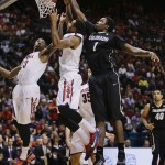 Arizona's Rondae Hollis-Jefferson, left, and Jordin Mayes, center, vie for a rebound against Colorado's Wesley Gordon during the second half of an NCAA college basketball game in the semifinals of the Pac-12 Conference on Friday, March 14, 2014, in Las Vegas. Arizona won 63-43. (AP Photo/Julie Jacobson)