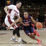 Arizona guard Parker Jackson-Cartwright, right, dribbles next to Stanford's Dorian Pickens (11) during the first half of an NCAA college basketball game Thursday, Jan. 22, 2015, in Stanford, Calif. (AP Photo/Marcio Jose Sanchez)
