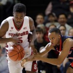 Stanford's Marcus Allen, left, vies for a loose ball against Arizona's Parker Jackson-Cartwright during the second half of an NCAA college basketball game Thursday, Jan. 22, 2015, in Stanford, Calif. Arizona won 89-82. (AP Photo/Marcio Jose Sanchez)