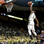 Oregon guard Joseph Young goes up to dunk against Arizona during the second half of an NCAA college basketball game against Arizona on Thursday, Jan. 8, 2015, in Eugene, Ore. Arizona won 80-62. (AP Photo/Ryan Kang)