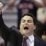 Arizona head coach Sean Miller gestures to his team as they play Gonzaga during the first half of a third-round game in the NCAA college basketball tournament Sunday, March 23, 2014, in San Diego. (AP Photo/Lenny Ignelzi)