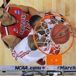 Ohio State's LaQuinton Ross, center, watches his basket drop as Arizona's Nick Johnson defends during the first half of a West Regional semifinal in the NCAA men's college basketball tournament, Thursday, March 28, 2013, in Los Angeles. (AP Photo/Mark J. Terrill)