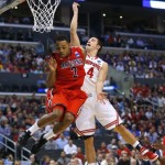 Ohio State's Aaron Craft (4) shoots next to Arizona's Mark Lyons (2) during the first half of a West Regional semifinal in the NCAA men's college basketball tournament, Thursday, March 28, 2013, in Los Angeles. (AP Photo/Jae C. Hong)