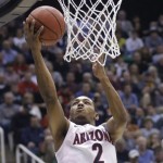 Arizona's Mark Lyons goes to the basket in the first half during a third-round game against Harvard in the NCAA men's college basketball tournament in Salt Lake City, Saturday, March 23, 2013. (AP Photo/Rick Bowmer)
