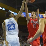  Arizona forward Aaron Gordon, right, shoots as UCLA forward/center Tony Parker (23) defends during the first half of an NCAA college basketball game on Thursday, Jan. 9, 2014, in Los Angeles. (AP Photo/Mark J. Terrill)