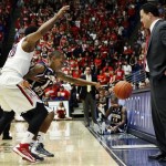 Northern Arizona's Dewayne Russell (12) loses the ball under pressure from Arizona's Jordin Mayes (20) and in front of Arizona head coach Sean Miller during the first half of an NCAA college basketball game at McKale Center in Tucson, Ariz., Wednesday, Nov. 28, 2012. (AP Photo/Wily Low)