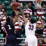 Belmont's Blake Jenkins (2) has his shot blocked by Arizona's Grant Jerrett during the first half of a second-round game in the NCAA college basketball tournament in Salt Lake City Thursday, March 21, 2013. (AP Photo/George Frey)