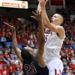 Arizona's Kaleb Tarczewski (35) shoots for two over the defense of Fairleigh Dickinson's Scooter Gillette (25) in the first half of an college NCAA basketball game, Monday, Nov. 18, 2013 in Tucson, Ariz. This is in the first round of the NIT. (AP Photo/John Miller) 
