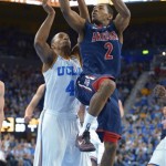 Arizona guard Mark Lyons, right, goes up for a shot as UCLA guard Norman Powell defends during the first half of an NCAA college basketball game, Saturday, March 2, 2013, in Los Angeles. (AP Photo/Mark J. Terrill)