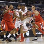 Ohio State's Lenzelle Smith Jr. works with the ball between Arizona's Mark Lyons, left, and Nick Johnson during the first half of a West Regional semifinal in the NCAA men's college basketball tournament, Thursday, March 28, 2013, in Los Angeles. (AP Photo/Jae C. Hong)