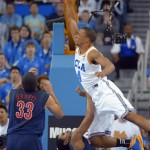 UCLA guard Norman Powell dunks over Arizona guard Jordin Mayes, below right, as forward Grant Jerrett watches during the first half of an NCAA college basketball game, Saturday, March 2, 2013, in Los Angeles. (AP Photo/Mark J. Terrill)