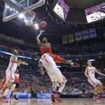 Arizona's Solomon Hill (44) goes to the basket over Ohio State's Deshaun Thomas (1) during the first half of a West Regional semifinal in the NCAA men's college basketball tournament, Thursday, March 28, 2013, in Los Angeles. (AP Photo/Mark J. Terrill)
