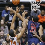 Arizona forward Grant Jerrett, right, blocks a shot by Oregon State forward Devon Collier during the first half of an NCAA college basketball game in Corvallis, Ore., Saturday, Jan. 12, 2013.(AP Photo/Don Ryan)