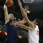 Arizona's Kaleb Tarczewski, left, goes up for a dunk against Southern California's Omar Oraby during the first half of an NCAA college basketball game in Los Angeles, Wednesday, Feb. 27, 2013. (AP Photo/Jae C. Hong)
