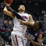 Arizona forward Brandon Ashley, left, is fouled by San Diego State forward Deshawn Stephens, right, in the first half of an NCAA college basketball game at the Diamond Head Classic, Tuesday, Dec. 25, 2012, in Honolulu. (AP Photo/Eugene Tanner)