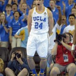 UCLA forward Travis Wear celebrates after dunking during the first half of an NCAA college basketball game against Arizona, Saturday, March 2, 2013, in Los Angeles. (AP Photo/Mark J. Terrill)