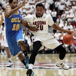 Arizona's Jordin Mayes (20) drives against UCLA's Larry Drew II during the first half of an NCAA college basketball game in Tucson, Ariz., Thursday, Jan. 24, 2013. (AP Photo/John Miller)