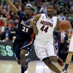 Arizona's Solomon Hill (44) drives to the basket as Belmont's Ian Clark defends in the first half during a second-round game in the NCAA college basketball tournament in Salt Lake City, Thursday, March 21, 2013. (AP Photo/George Frey)