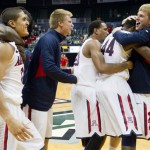 Arizona celebrates after beating San Diego State to win the Diamond Head Classic in an NCAA college basketball game at the Diamond Head Classic Tuesday, Dec. 25, 2012, in Honolulu. Arizona defeated San Diego State 68-67. (AP Photo/Eugene Tanner)

