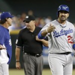 Los Angeles Dodgers' Adrian Gonzalez (23) keeps yelling after he is ejected for arguing a call in the sixth inning as Dodgers' manager argues with umpire Andy Fletcher during a baseball game against the Arizona Diamondbacks on Wednesday, Sept. 18, 2013, in Phoenix. (AP Photo/Ross D. Franklin)
