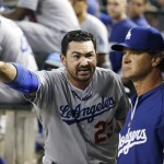 Los Angeles Dodgers' Adrian Gonzalez (23) tries to explain to manager Don Mattingly why he argued a call that got him ejected in the sixth inning during a baseball game against the Arizona Diamondbacks on Wednesday, Sept. 18, 2013, in Phoenix. (AP Photo/Ross D. Franklin)

