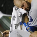 Los Angeles Dodgers pitcher Stephen Fife wipes sweat from his face after being pulled from the baseball game in the third inning against the Arizona Diamondbacks on Wednesday, Sept. 18, 2013, in Phoenix. (AP Photo/Ross D. Franklin)
