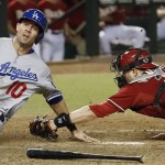 Los Angeles Dodgers' Michael Young (10) is called out on a play at home plate as Arizona Diamondbacks' Miguel Montero applies the tag in the sixth inning during a baseball game on Wednesday, Sept. 18, 2013, in Phoenix. (AP Photo/Ross D. Franklin)
