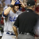 Los Angeles Dodgers' Michael Young, left, shows his disbelief after being called out on a play at home plate by umpire Joe West in the sixth inning during a baseball game against the Arizona Diamondbacks on Wednesday, Sept. 18, 2013, in Phoenix. (AP Photo/Ross D. Franklin)
