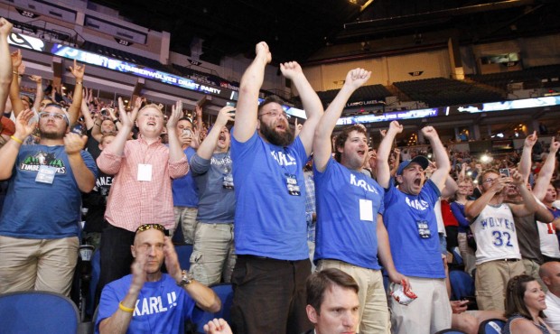 Minnesota Timberwolves fans, including fans wearing “Karl!!” T-shirts, cheer as Kentuck...