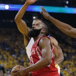 
              Houston Rockets guard James Harden dribbles past Golden State Warriors forward Andre Iguodala during the first half of Game 1 of the NBA basketball Western Conference finals in Oakland, Calif., Tuesday, May 19, 2015. (AP Photo/Tony Avelar)
            