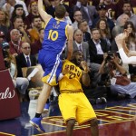 
              Cleveland Cavaliers forward LeBron James (23) attempts to draw the charge from Golden State Warriors forward David Lee (10) during the second half of Game 3 of basketball's NBA Finals in Cleveland, Tuesday, June 9, 2015. (AP Photo/Paul Sancya)
            