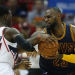               Cleveland Cavaliers forward LeBron James (23) drives against Atlanta Hawks guard Dennis Schroder (17) during the first half in Game 1 of the Eastern Conference finals of the NBA basketball playoffs, Wednesday, May 20, 2015, in Atlanta. (AP Photo/John Bazemore)
            