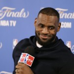 
              Cleveland Cavaliers forward LeBron James smiles during a news conference after Game 2 of basketball's NBA Finals Sunday, June 7, 2015, in Oakland, Calif. Cleveland won the game in 95-93 in overtime. (AP Photo/Ben Margot)
            