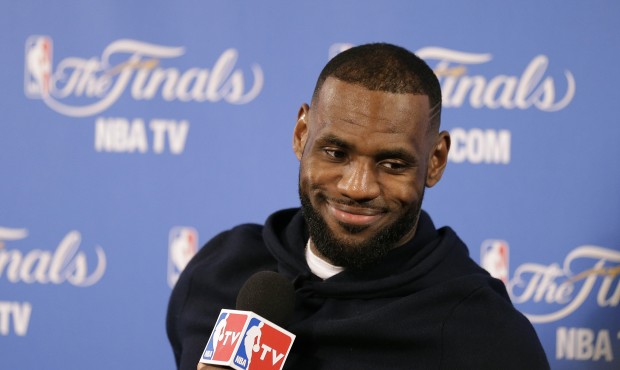 Cleveland Cavaliers forward LeBron James smiles during a news conference after Game 2 of basketball...