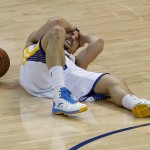 
              Golden State Warriors guard Klay Thompson lies on the court after being injured during the second half of Game 5 of the NBA basketball Western Conference finals against the Houston Rockets in Oakland, Calif., Wednesday, May 27, 2015. (AP Photo/Tony Avelar)
            