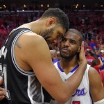
              San Antonio Spurs forward Tim Duncan, left, hugs Los Angeles Clippers guard Chris Paul after the Clippers won Game 7 in a first-round NBA basketball playoff series, Saturday, May 2, 2015, in Los Angeles. The Clippers won 111-109. (AP Photo/Mark J. Terrill)
            