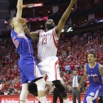 
              Houston Rockets' James Harden (13) shoots past Los Angeles Clippers' Austin Rivers during the second half of Game 2 in a second-round NBA basketball playoff series, Wednesday, May 6, 2015, in Houston. (AP Photo/David J. Phillip)
            