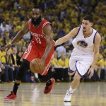 
              Houston Rockets' James Harden, left, drives the ball past Golden State Warriors' Klay Thompson (11) during the first quarter of Game 1 of the NBA basketball Western Conference finals Tuesday, May 19, 2015, in Oakland, Calif. (AP Photo/Ben Margot)
            